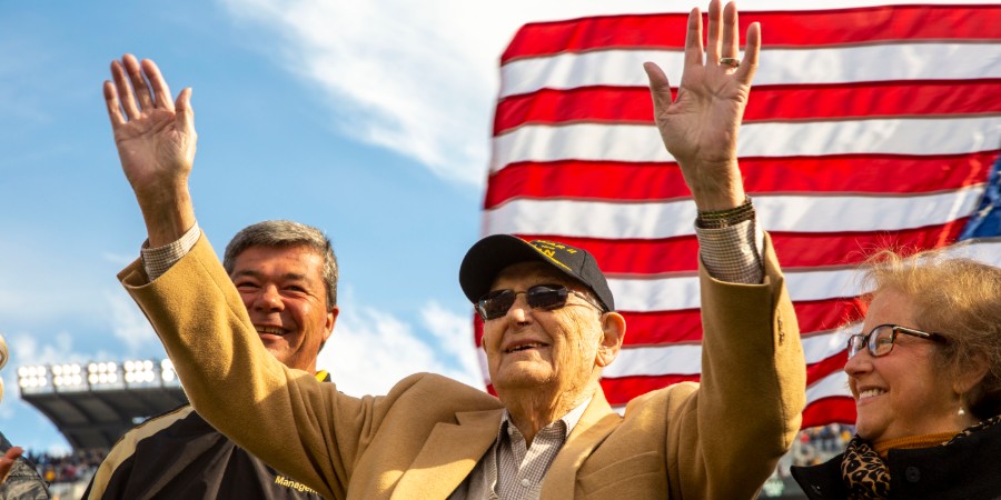 World War 2 Veteran Major Harvey B. Young Jr. waves to the crowd.