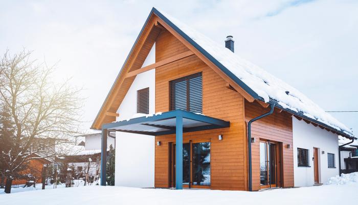 Barndominium house with snow. 