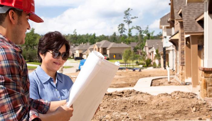 builder meeting woman new home construction