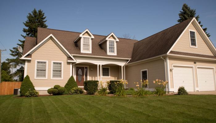 Suburban house with spacious lawn.