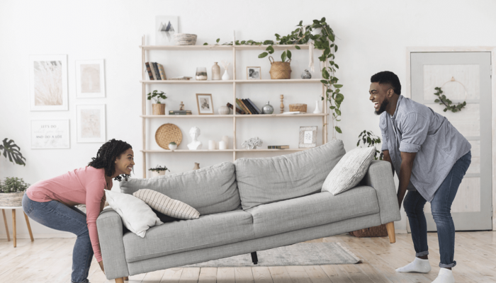 Couple moving couch.