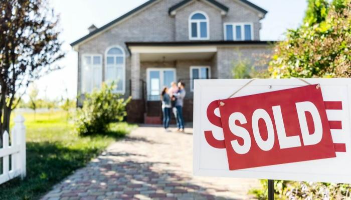 Sold sign in front of a home.