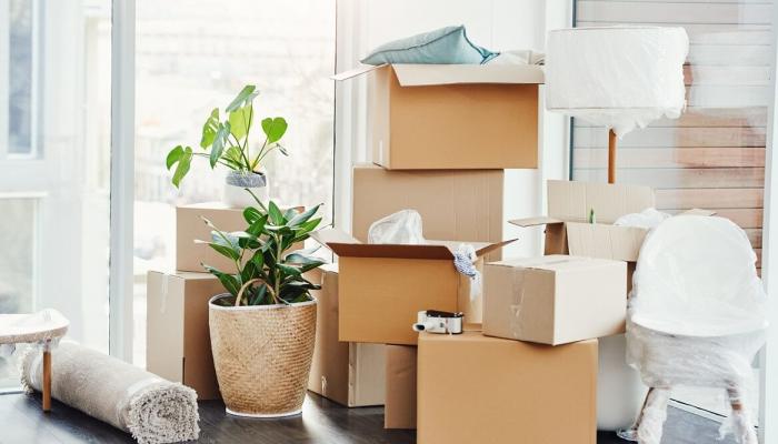 Pile of boxes and personal belongings prepared to move.