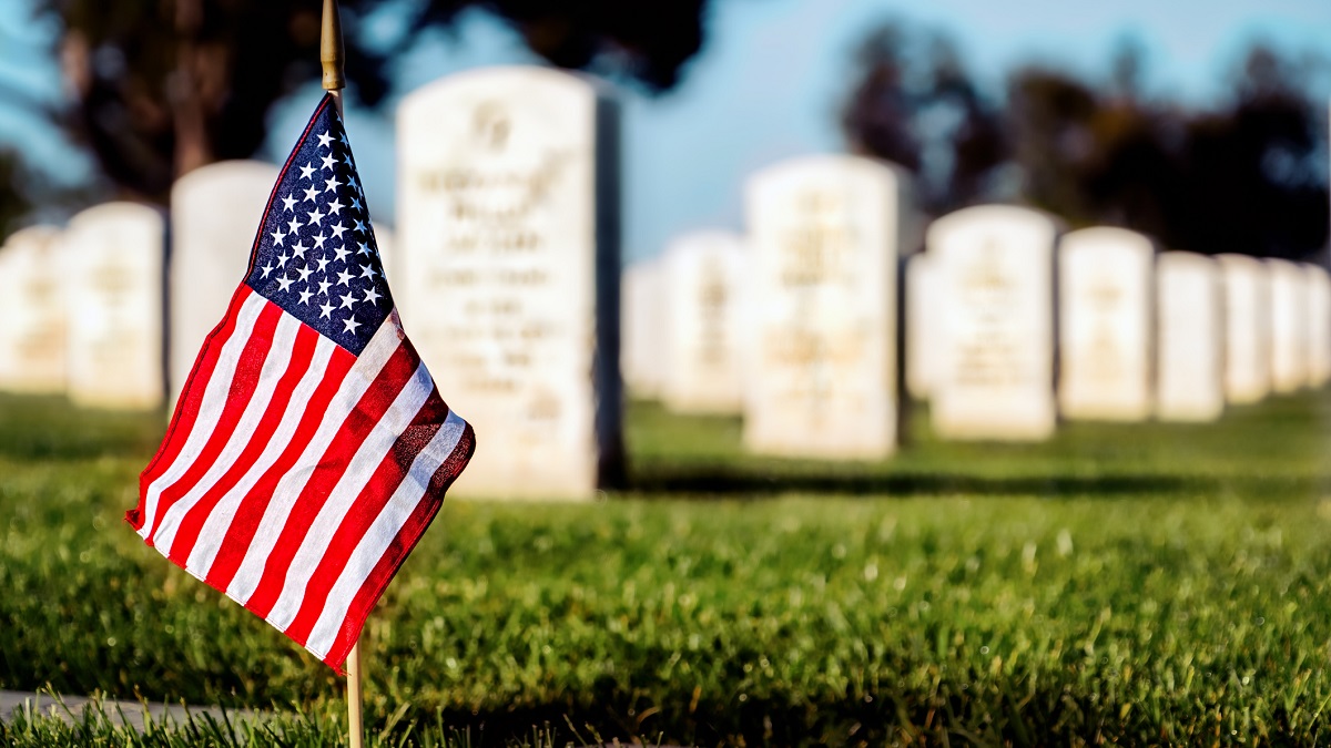 Flag planted in military cemetary.