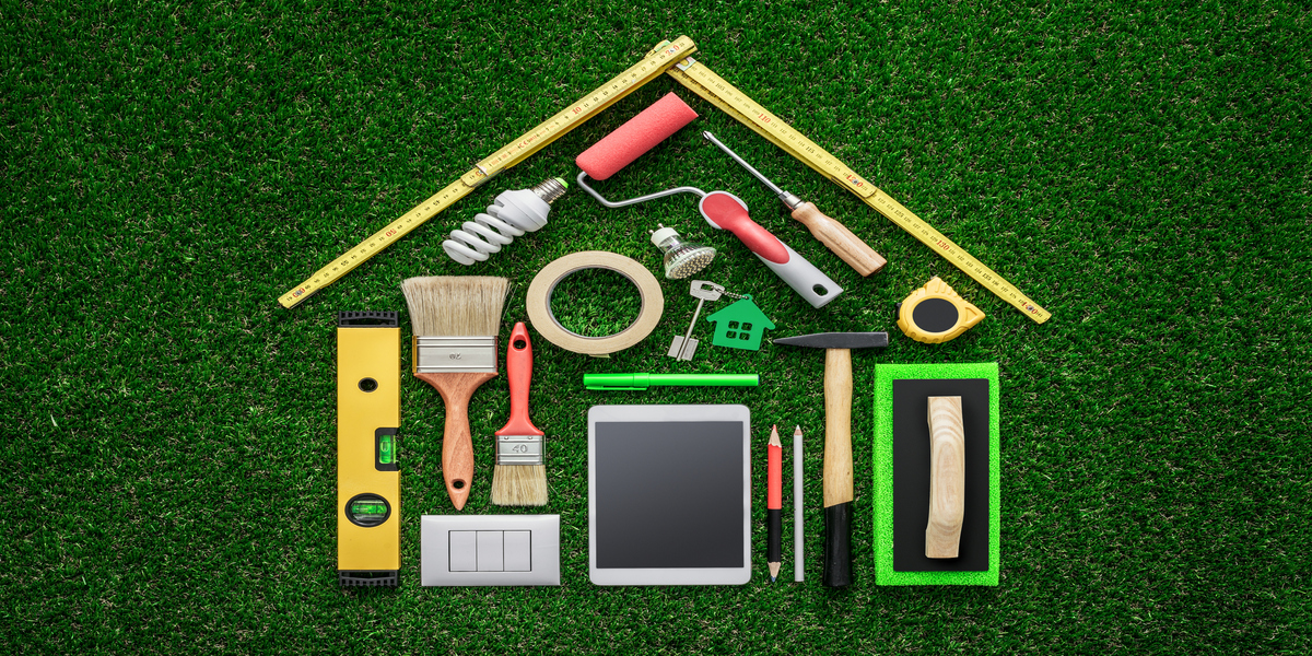 Various tools laid out in the shape of a house.