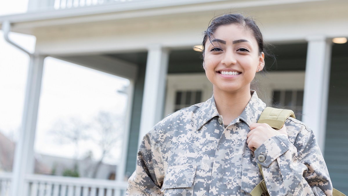Female soldier smiles for portrait. 