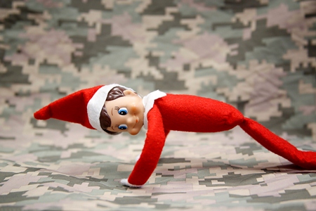 Elf doing pushups with camoflage background