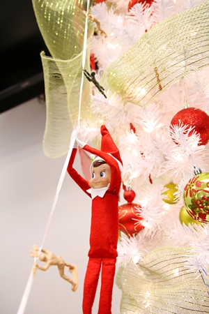 Elf on a Shelf on a Zipline with Toy Soldiers