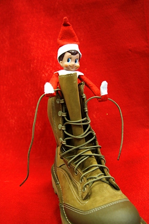 Elf learns to tie up combat boots