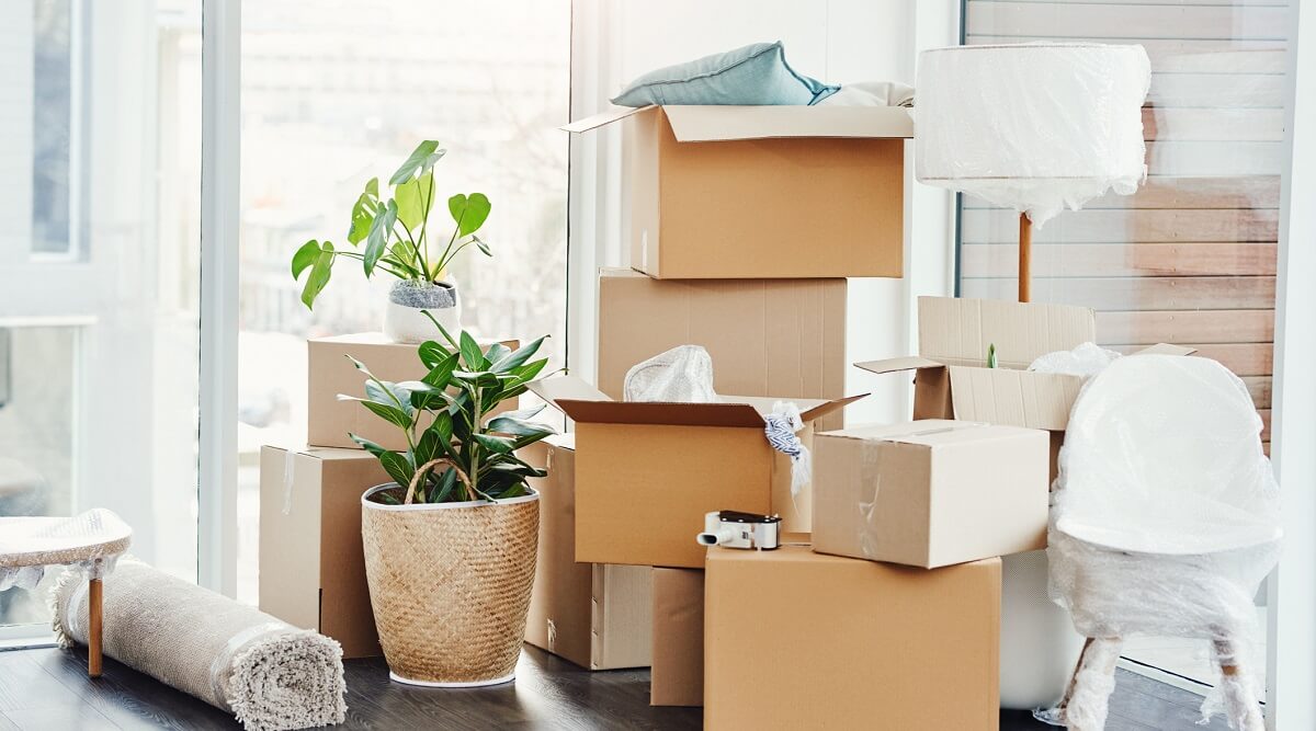 Pile of boxes and personal belongings prepared to move.