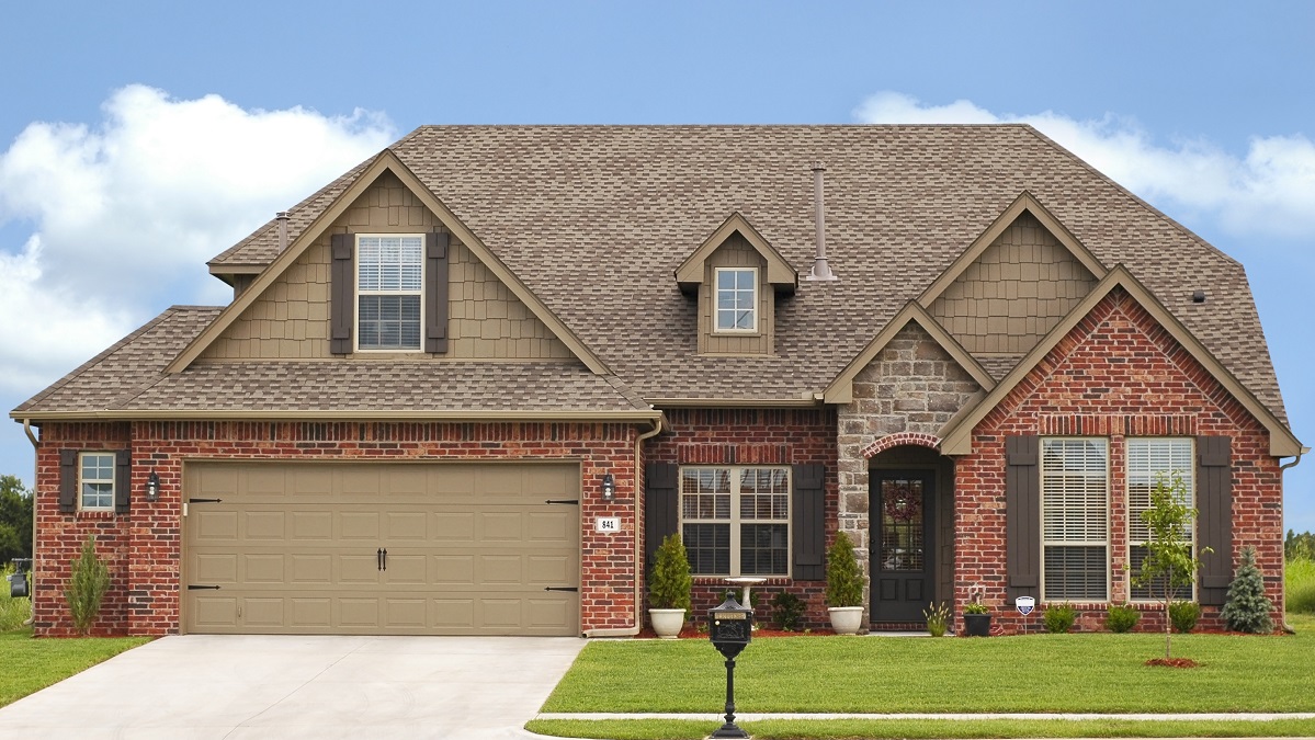 Front view of a large brick house. 