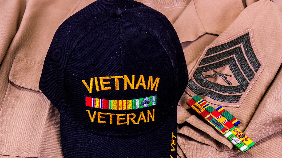 Close up of Vietnam Veteran hat on dress uniform with honor ribbons.
