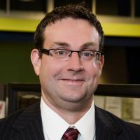 headshot image of Trevor Lally