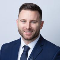 headshot image of Justin Menard