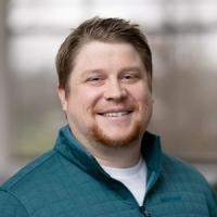 headshot image of Brett Kenney