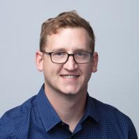 headshot image of Dustin Bess