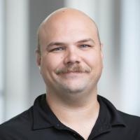 headshot image of Phillip Kast