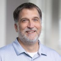 headshot image of Greg Tartaglia