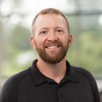 headshot image of Joshua Schultz