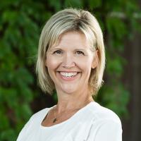 headshot image of Ali Schellenberg