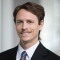 headshot image of Adam Hastings