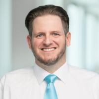 headshot image of AJ Greiner