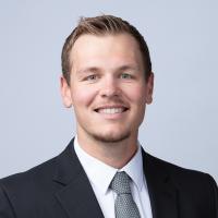 headshot image of Brett Metcalf