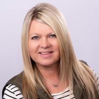 headshot image of Brook Holcomb