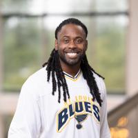 headshot image of Corey Jackson