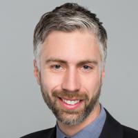 headshot image of Corey Nichols