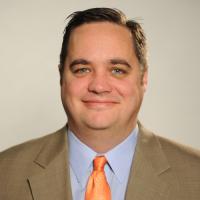 headshot image of Doug Brady