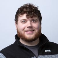 headshot image of Drew Crowley