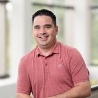 headshot image of Evan Carmichael