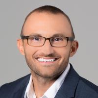 headshot image of Garrett Holzum