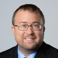 headshot image of Greg Heins