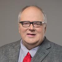 headshot image of Jim Schrader