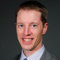 headshot image of Joel Gigler