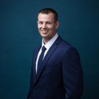 headshot image of Josh Carlyon