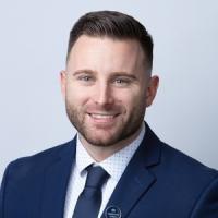 headshot image of Justin Menard