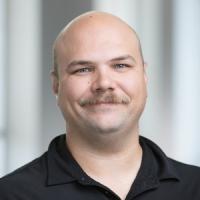 headshot image of Phillip Kast