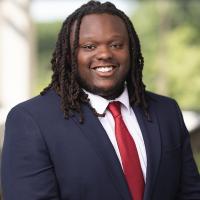 headshot image of Sam Sibajene