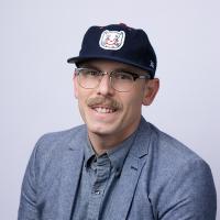 headshot image of Shaine Griggs