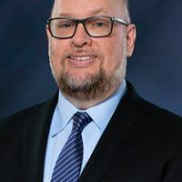 headshot image of Shawn Kuhns