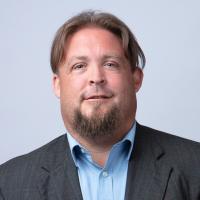 headshot image of Tom Hayes