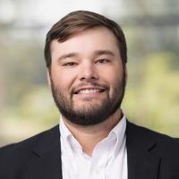 headshot image of Travis Knierim