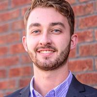 headshot image of Trevor Damer
