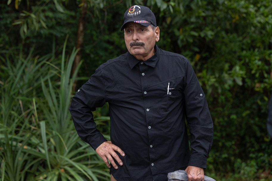 Esteban Valenzuela standing outdoors among dense vegetation in Vietnam.