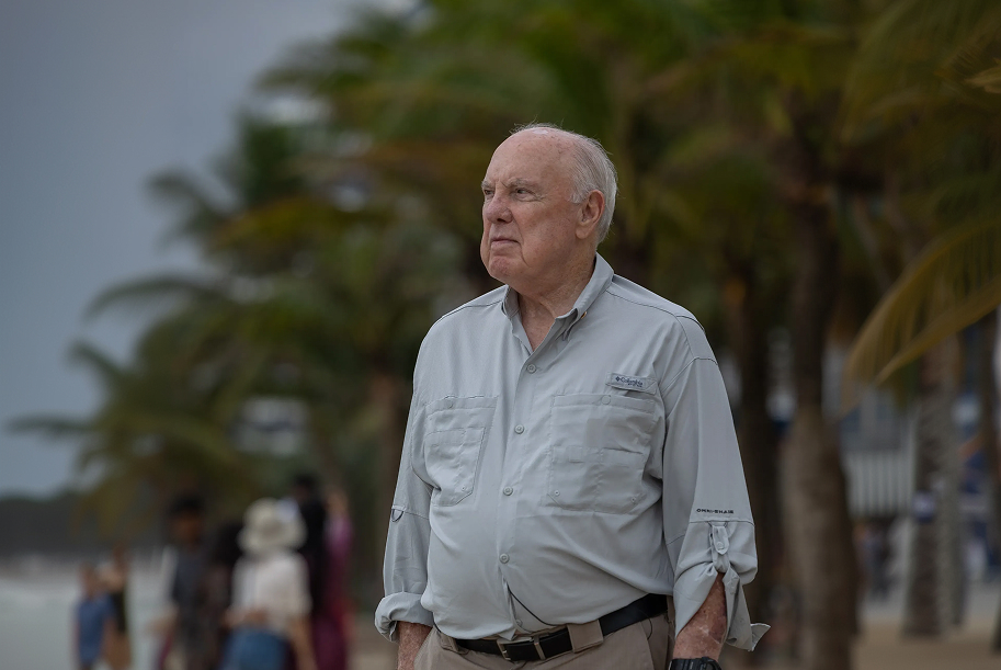 James "Jim" Taylor looking into the distance outdoors in Vietnam.